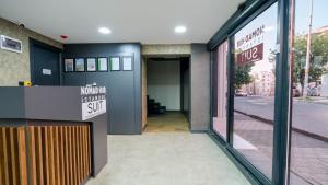 a store front with a sign that reads world is gonna quit at Nomad Hub Suit İstanbul in Istanbul