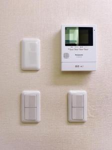 a wall with three switches and a microwave at Poppy ikebukuro in Wada +47 photos