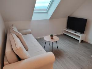 Μια τηλεόραση ή/και κέντρο ψυχαγωγίας στο Bruchsal Business Apartment - Schreibtisch - Smart-TV