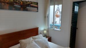 Postel nebo postele na pokoji v ubytování Típica casa sevillana en el barrio de Triana