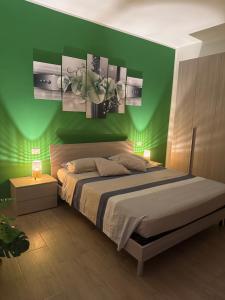 Ένα ή περισσότερα κρεβάτια σε δωμάτιο στο Casetta di Massa