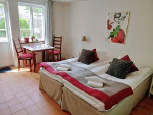 Ένα ή περισσότερα κρεβάτια σε δωμάτιο στο Munkamöllan B&B Skåne Tranås