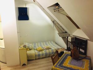 a room with a bunk bed and a staircase at Villa de charme, 15 personnes, vue canal in Rohan