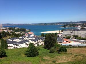 a view of a city and a body of water at Hospedaje Lopez in A Coruña