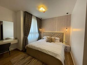 a bedroom with a large bed with a window at 2 - 4 bedroom apartments in Eko Atlantic City in Lagos
