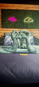 a large snake laying on top of a bed at Chalet cosy avec vue imprenable in Le Luc