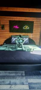 a bed with an octopus on top of it at Chalet cosy avec vue imprenable in Le Luc