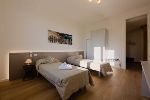 Postel nebo postele na pokoji v ubytování Camera Rio - La Casa di Carta Affittacamere