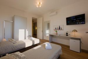 Postel nebo postele na pokoji v ubytování Camera Rio - La Casa di Carta Affittacamere