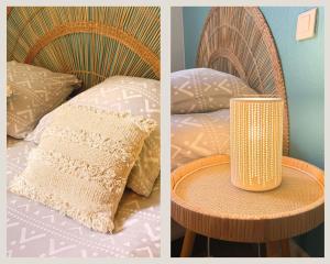 a bed with a table with a pillow and a lamp at Studio Boho-Chic en centre ville in Moulins +20 photos