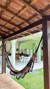 a hammock hanging from awning in a house at Pousada Cantinho da Mata in Paraty