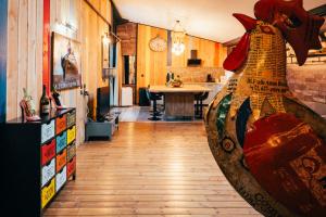a kitchen with a large vase in the middle of a room at La Grange in Sablons