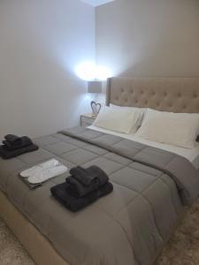 Ένα ή περισσότερα κρεβάτια σε δωμάτιο στο Theo Luxury House