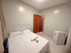 Postel nebo postele na pokoji v ubytování Sky Hotel Ltda