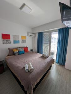 a bedroom with a large bed with pillows on it at Lihnidos Home, Central Apartment, AC, Lake Access, Beach in Ohrid