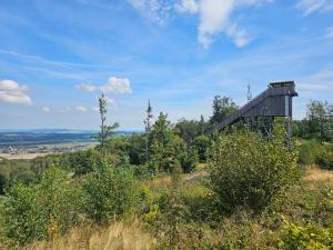 a wooden building on top of a hill at Alte Bibliothek in Kottmar