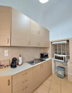 Η κουζίνα ή μικρή κουζίνα στο Sigma Guesthouse