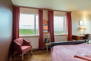 Postel nebo postele na pokoji v ubytování Hotel Latrabjarg
