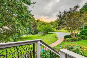 a balcony with a view of a park with a playground at Magical Bayfrnt Home, Pier, Beach, Fossils, Trails in Port Republic