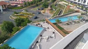 an overhead view of a swimming pool at a hotel at Ellipse Lux Hotel - Apartment in Midrand +2 photos