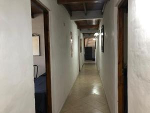 an empty hallway with a long hallway with at Hostería Michel in Villa Gesell