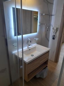 a bathroom with a sink and a mirror at BEACH WHTE VILLAs one bedroom in Minia +36 photos