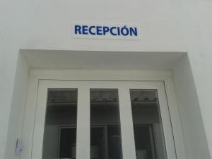 a sign above the door of a building at La Chanca in Conil de la Frontera