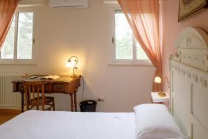 Postel nebo postele na pokoji v ubytování Musa Maris - Villa panoramica con piscina + 49 fotografií