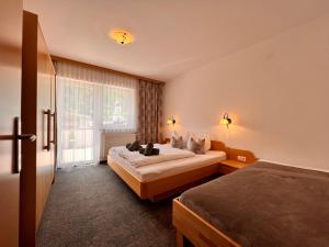 Giường trong phòng chung tại Appart Kofler