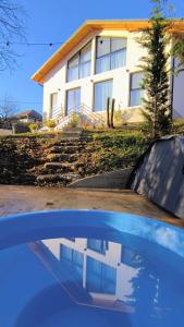 a car parked in front of a house at Casa Runcu Dambovita in Bădeni