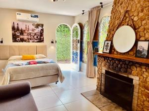 Postel nebo postele na pokoji v ubytování Pousada Casinha Amarela - Campos do Jordão