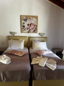 Postel nebo postele na pokoji v ubytování Voula Studio + 2 fotografie