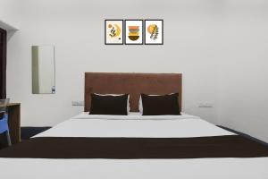 Postel nebo postele na pokoji v ubytování Hotel O Smriti Villa