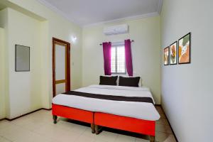 a bedroom with a large bed in a room at HOTEL O REEYH INN in Khāpri