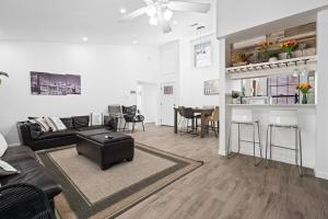 a living room with a couch and a table at Spacious Family Home in Round Rock w Private Yard in Round Rock