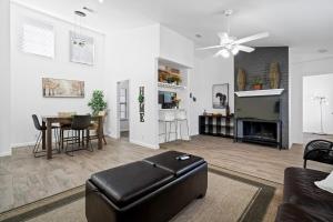 a living room with a couch and a table at Spacious Family Home in Round Rock w Private Yard in Round Rock