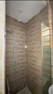 a bathroom with a shower and a sink at Smartlinks apartments in Ikota