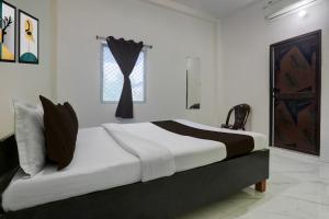 Giường trong phòng chung tại Hotel O Nandan Palace +21 ảnh