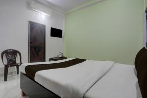 Giường trong phòng chung tại Hotel O Nandan Palace