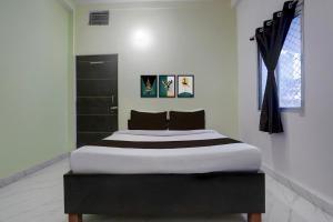 Giường trong phòng chung tại Hotel O Nandan Palace