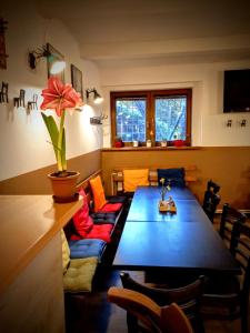 a living room with a long table and a couch at Penzion Bezděkov in Rakovník