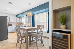 a kitchen with a table and chairs in a kitchen at Spacious 4BR w Fenced Yard in Round Rock