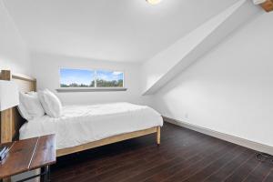 a bedroom with a bed and a window at Spacious 4BR w Fenced Yard in Round Rock