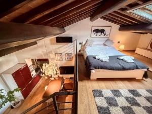 a bedroom with a bed in a attic at Cognaia Loft in Arezzo
