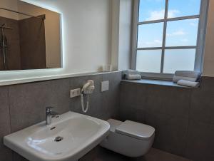 Et badeværelse på Heskeshof Ferienwohnungen