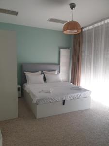 Ένα ή περισσότερα κρεβάτια σε δωμάτιο στο River Apartment