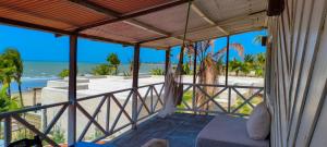 a view of the beach from the porch of a beach house at Casa Janjão in Icaraí