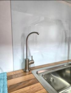 a kitchen sink with a faucet on a counter at fuga romantica in Benisuera +12 photos