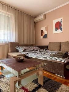 Postel nebo postele na pokoji v ubytování Apartman ASKA