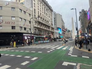 a city street with a green crosswalk in the middle at Suipacha Boutique in Buenos Aires